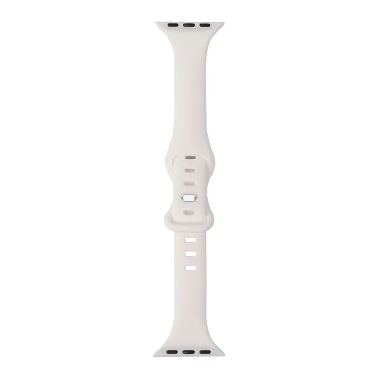 slimming silicone replacement strap for Apple Watch in soft white color, designed for comfort and easy adjustment.