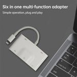NK-1042 Adaptateur de caméra 6 en 1 8 broches mâle vers double USB + double carte SD + interface audio 3,5 mm + interface de charge 8 broches femelle