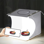Kit de studio photo portable pliable avec panneau LED annulaire PULUZ de 23 cm, comprenant une tente et 6 fonds de couleur (noir, blanc, jaune, rouge, vert, bleu). Dimensions déplié : 24 cm x 23 cm x 23 cm. Panneau LED annulaire de 23 cm.