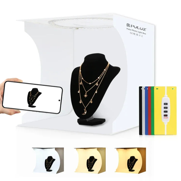 Kit de studio photo portable et pliable PULUZ avec anneau lumineux de 30 cm et 6 fonds de couleur (noir, blanc, jaune, rouge, vert, bleu). Dimensions déplié : 31 cm x 31 cm x 32 cm. Boîte de 30 cm.