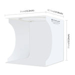Kit de studio photo portable et pliable PULUZ avec anneau lumineux de 30 cm et 6 fonds de couleur (noir, blanc, jaune, rouge, vert, bleu). Dimensions déplié : 31 cm x 31 cm x 32 cm. Boîte de 30 cm.
