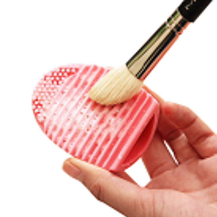 Outil de nettoyage en silicone pour pinceaux de maquillage et brosses de lavage.
