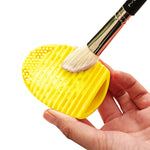 Outil de nettoyage en silicone pour pinceaux de maquillage et brosses de lavage.