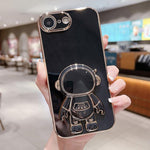 Coque de téléphone plaquée avec support Astronaute, Pour iPhone 17e / 16e, Pour iPhone 17 Pro Max, Pour iPhone 17 Pro, Pour iPhone 17, Pour iPhone Air, Pour iPhone 16 Pro Max, Pour iPhone 16 Pro, Pour iPhone 16 Plus