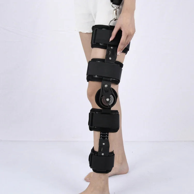 Genouillère de fixation réglable pour la protection des blessures au genou et des fractures (noir), taille unique