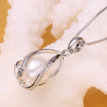 Pendentif Cage Femme Perle Naturelle