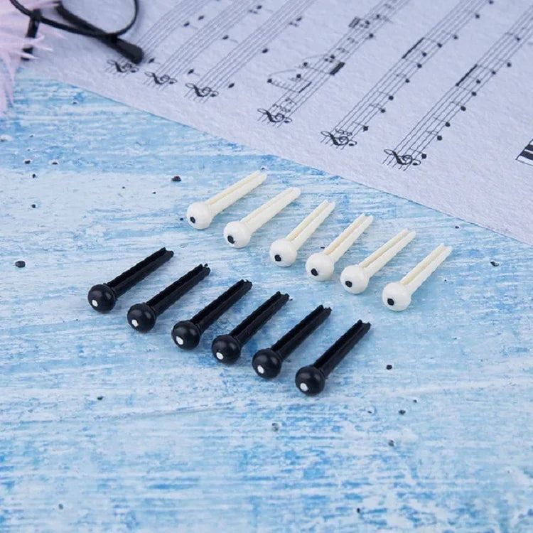 100 clous coniques en plastique pour cordes de guitare