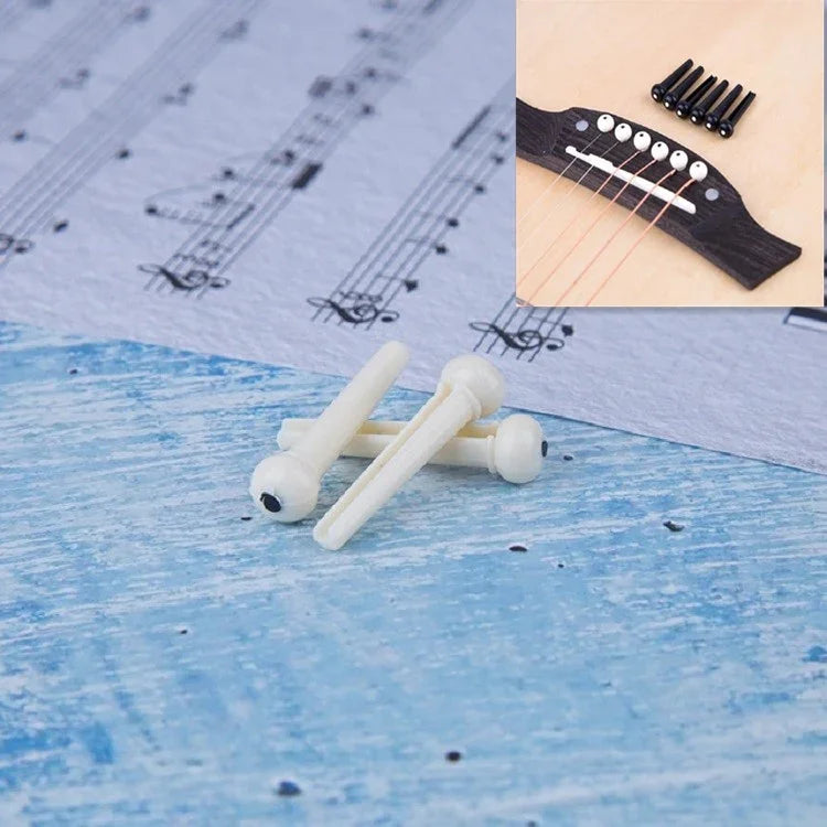 100 clous coniques en plastique pour cordes de guitare