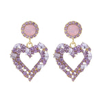 Boucles d'oreilles clou Amour Aiguille d'Argent, E2109-12 Diamant violet, E2109-13 Diamant blanc, E2112-9 Amour asymétrique or, E2112-10 Amour asymétrique K blanc