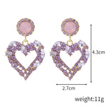 Boucles d'oreilles clou Amour Aiguille d'Argent, E2109-12 Diamant violet, E2109-13 Diamant blanc, E2112-9 Amour asymétrique or, E2112-10 Amour asymétrique K blanc
