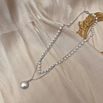 Collier à pendentif double rang de perles et perles simples