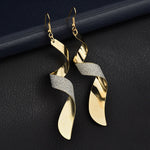 Boucles d'oreilles 3D créoles longues torsadées givrées