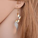 Boucles d'oreilles 3D créoles longues torsadées givrées