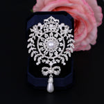 2 broches couronne, papillon de perle, gland, argent, or